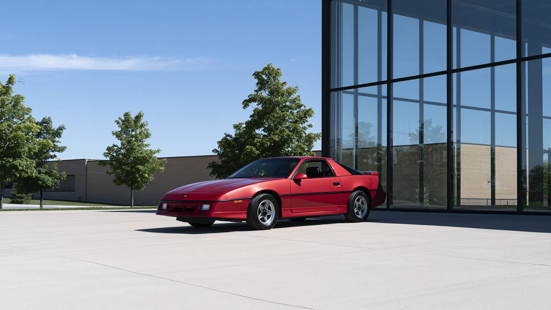 The main prize sports coupé photographed outside the dealership showroom in Ajax